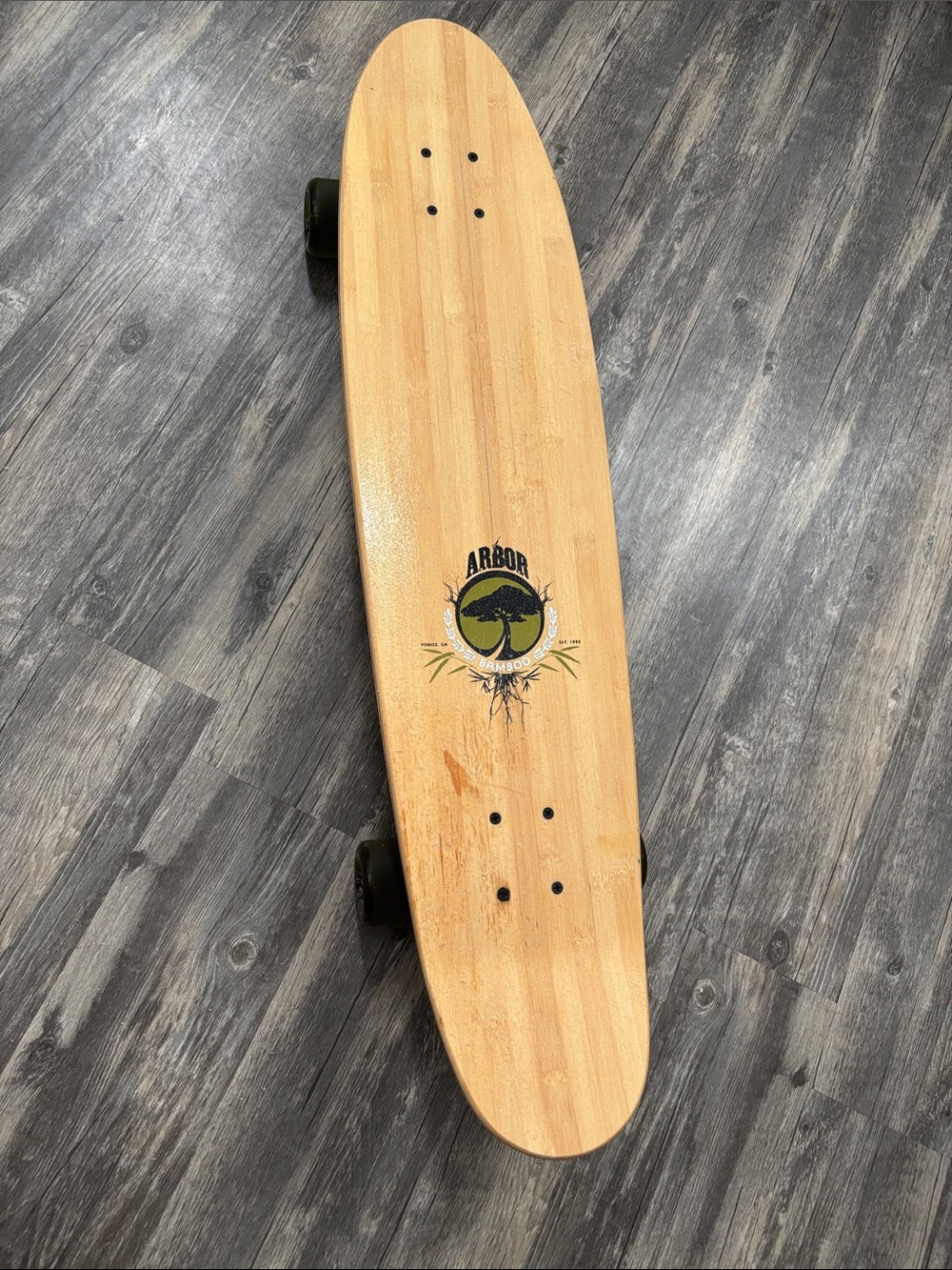 Skateboard on floor Jack Johnson/ Brushfire Records